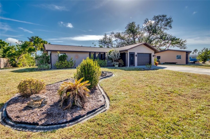 This professionally decorated and updated waterfront pool home - Beach Home for sale in Port Charlotte, Florida on Beachhouse.com