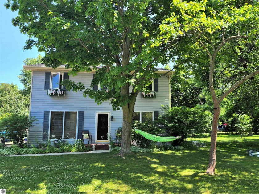 Check out this Gem in the Village of Elk Rapids. Located just a - Beach Home for sale in Elk Rapids, Michigan on Beachhouse.com