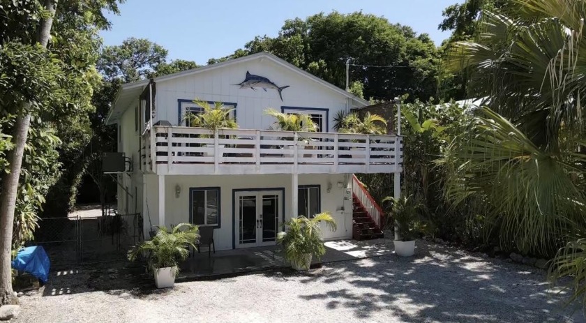 Enjoy a peek-a-boo ocean view as you turn down the street off of - Beach Home for sale in Key Largo, Florida on Beachhouse.com