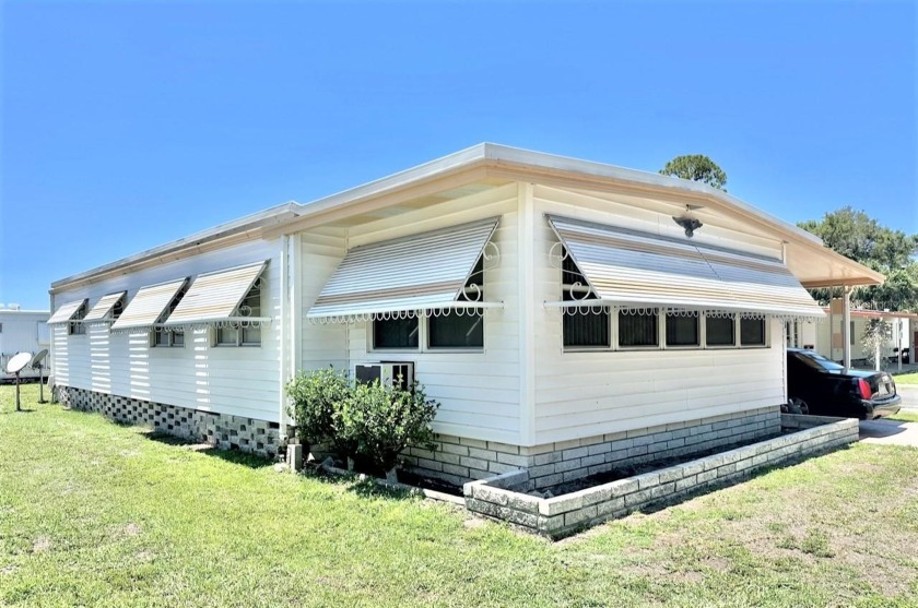 Lovely 2 bedroom, 2 bath, Doublewide, with front 10x19 Florida - Beach Home for sale in Pinellas Park, Florida on Beachhouse.com