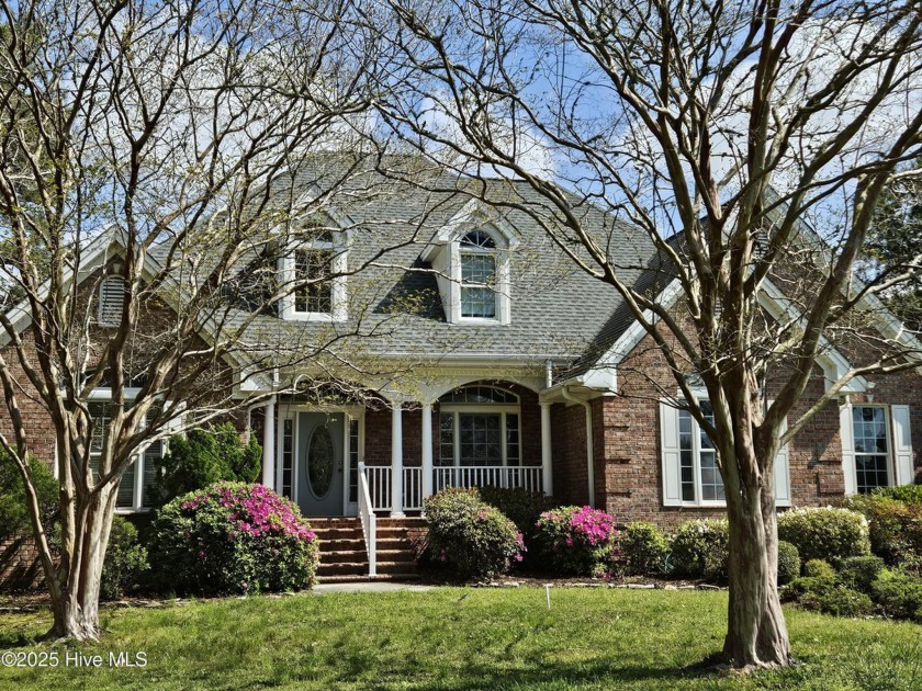 This 4 BR, 3 BA brick home overlooks a large pond and is - Beach Home for sale in Ocean Isle Beach, North Carolina on Beachhouse.com