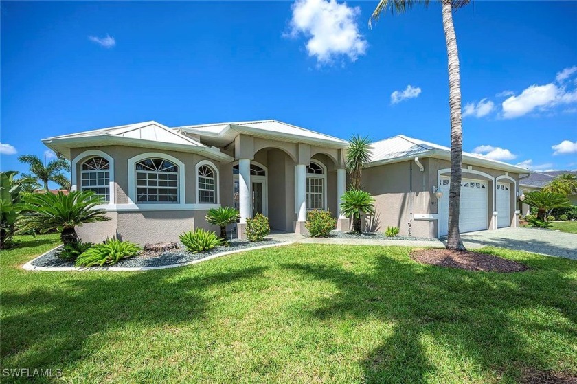 This 3 bedroom plus den 3 bathroom pool home with 3 car garage - Beach Home for sale in Cape Coral, Florida on Beachhouse.com