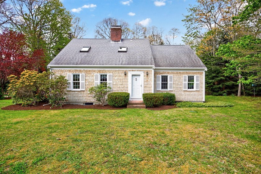 Tucked away on a private lane in desirable East Orleans, this - Beach Home for sale in Orleans, Massachusetts on Beachhouse.com