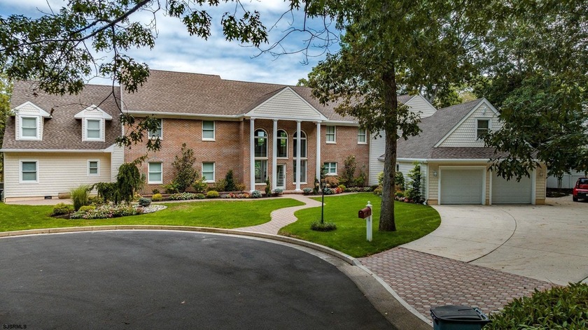 Lakefront living and cul-de-sac privacy define this expansive - Beach Home for sale in Linwood, New Jersey on Beachhouse.com