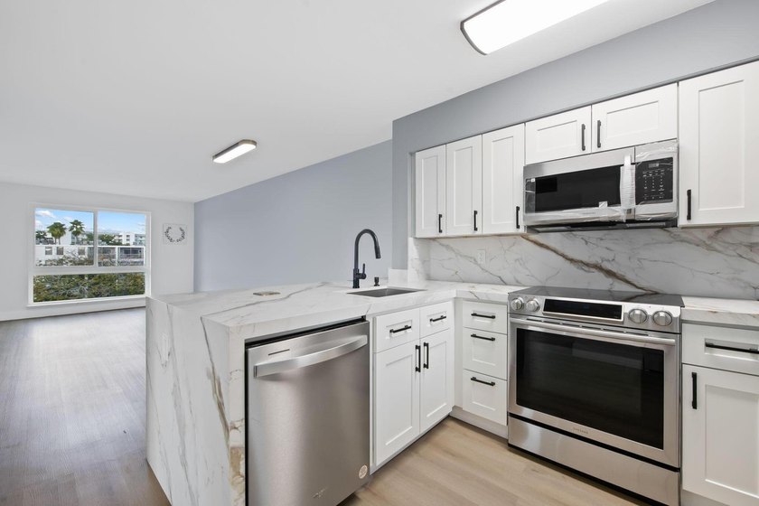 Top-floor, renovated 2-bedroom, 2-bath corner unit with serene - Beach Condo for sale in Pompano Beach, Florida on Beachhouse.com