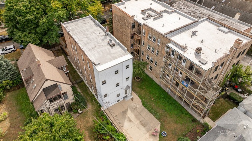 This classic 1890 stone and brick 3-flat plus basement on an - Beach Home for sale in Chicago, Illinois on Beachhouse.com