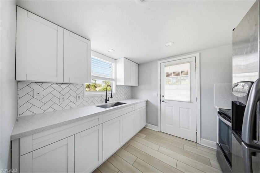 This beautiful two-story home is centrally located and offers - Beach Home for sale in Lehigh Acres, Florida on Beachhouse.com