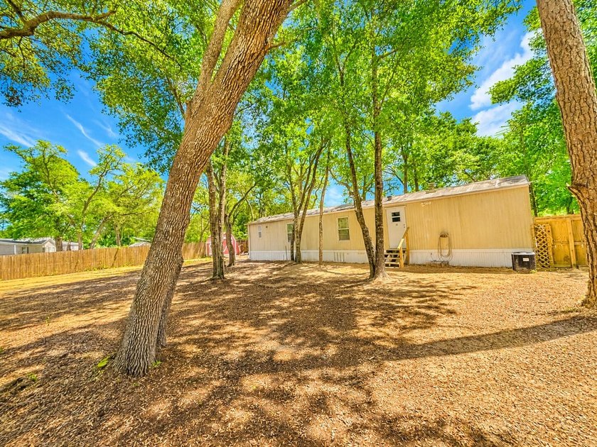 This charming, older 2-bedroom, 2-bath mobile home sits on a - Beach Home for sale in Southport, Florida on Beachhouse.com