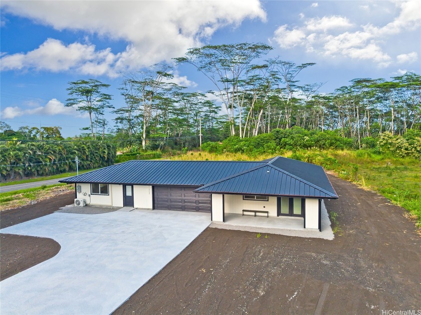 Brand new and custom built, this thoughtfully designed home sits - Beach Home for sale in Keaau, Hawaii on Beachhouse.com
