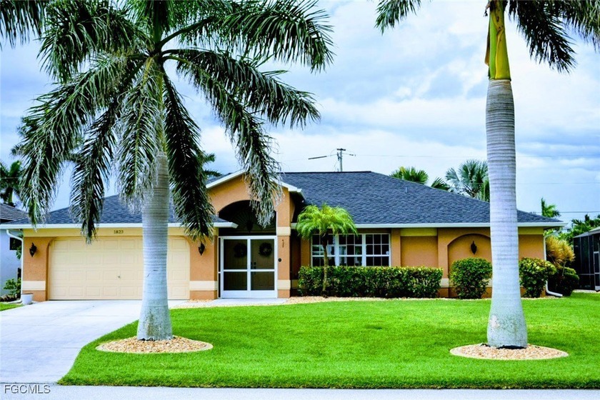 Welcome to this beautifully landscaped well maintained pool home - Beach Home for sale in Cape Coral, Florida on Beachhouse.com