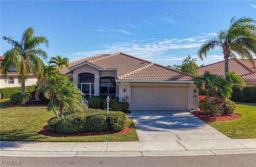 This beautifully maintained LAKEFRONT Sandpiper model home in - Beach Home for sale in North Fort Myers, Florida on Beachhouse.com