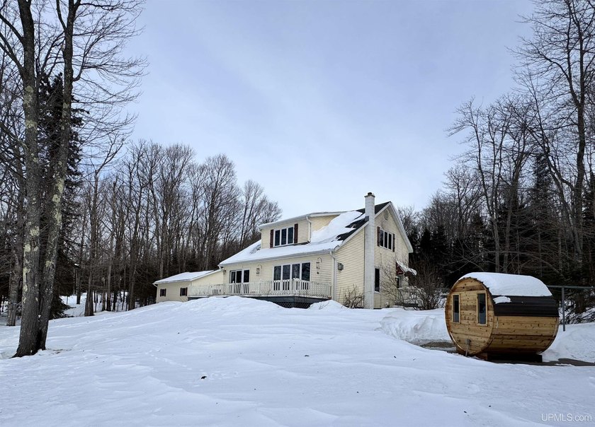 Enjoy 167' of Lake Superior shoreline with this charming yet - Beach Home for sale in L Anse, Michigan on Beachhouse.com