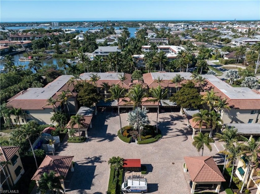 Tucked within the lush, tropical setting of The Naples Bay - Beach Condo for sale in Naples, Florida on Beachhouse.com