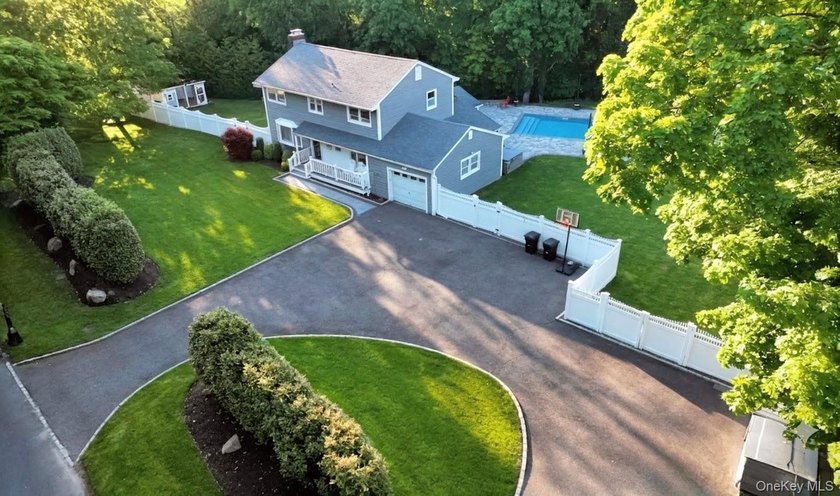 Welcome to this spectacular 5-bedroom, 1.5-bath Colonial nestled - Beach Home for sale in Saint James, New York on Beachhouse.com