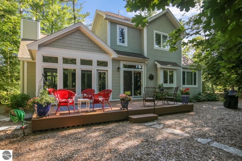Beautiful and updated home in Woodstone. Lovely view, privacy - Beach Home for sale in Glen Arbor, Michigan on Beachhouse.com