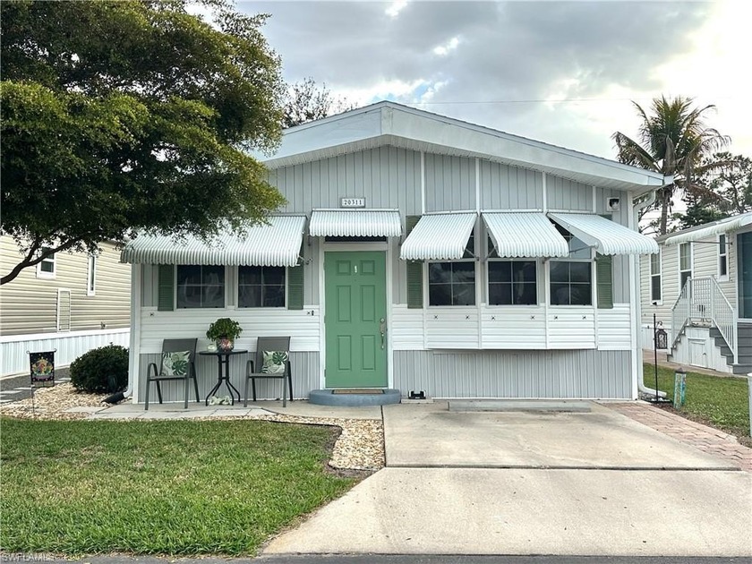 Charming Pet-Friendly Manufactured Home in Vibrant 55+ Community - Beach Home for sale in Estero, Florida on Beachhouse.com