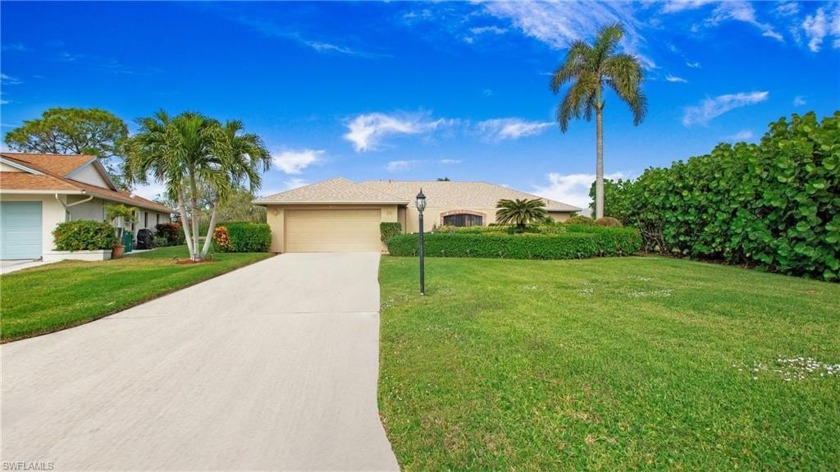 Located on a peaceful cul-de-sac in the Lakewood community, this - Beach Home for sale in Naples, Florida on Beachhouse.com