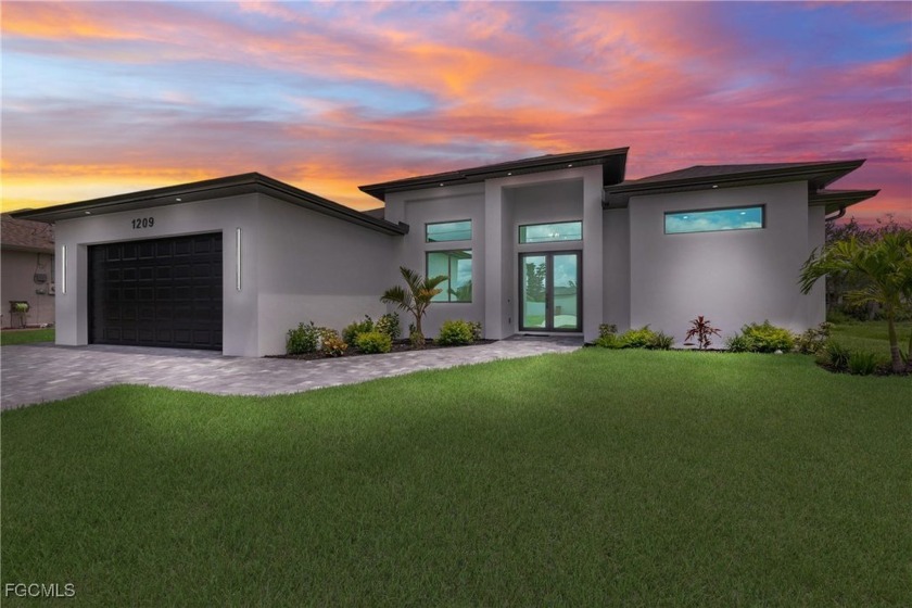 Step into this stunning new construction home featuring sleek - Beach Home for sale in Cape Coral, Florida on Beachhouse.com