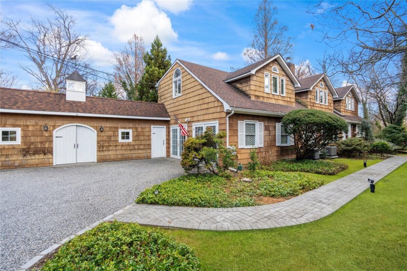 Nestled on 3/4 flat acres, on one of the largest properties on - Beach Home for sale in Glen Cove, New York on Beachhouse.com