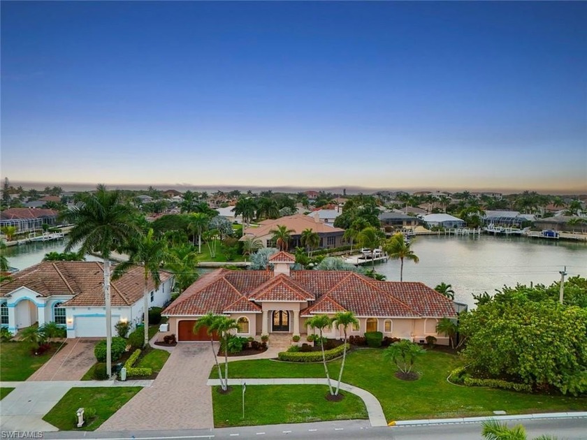 Set on a rare, oversized tip lot, this Marco Island residence - Beach Home for sale in Marco Island, Florida on Beachhouse.com
