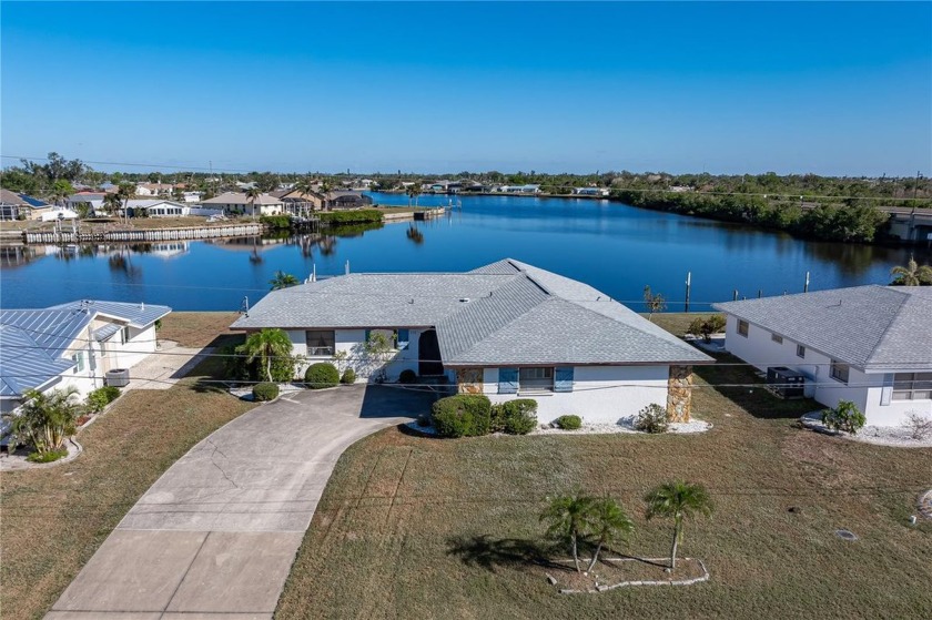 EXCEPTIONAL WATER VIEW! This 2 bed/2 bath + den, waterfront home - Beach Home for sale in Port Charlotte, Florida on Beachhouse.com