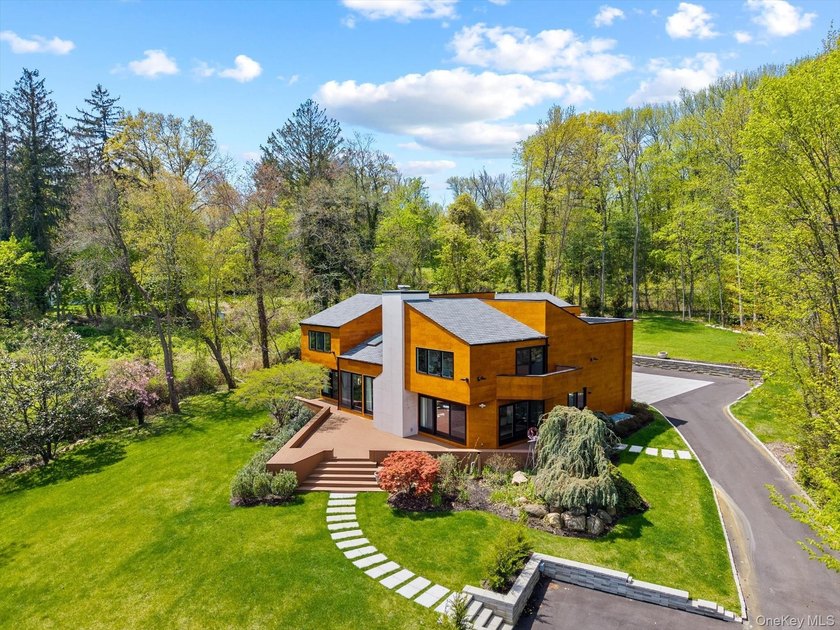 Privately set behind a long driveway in the prestigious Village - Beach Home for sale in Great Neck, New York on Beachhouse.com