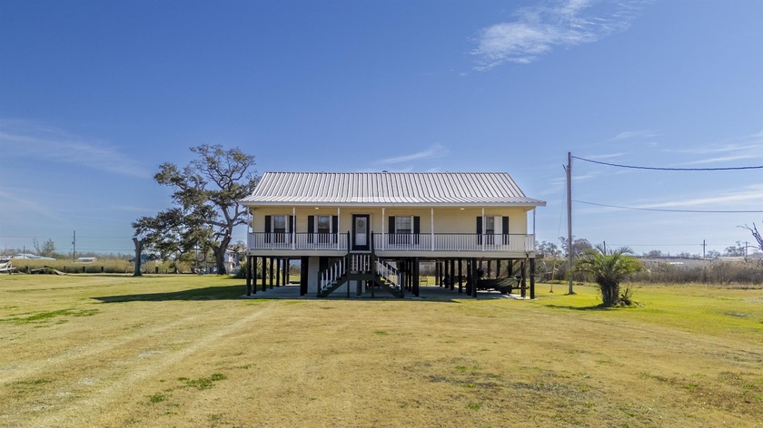 This fully furnished 3-bedroom, 2-bath fishing camp sits on - Beach Home for sale in Dulac, Louisiana on Beachhouse.com