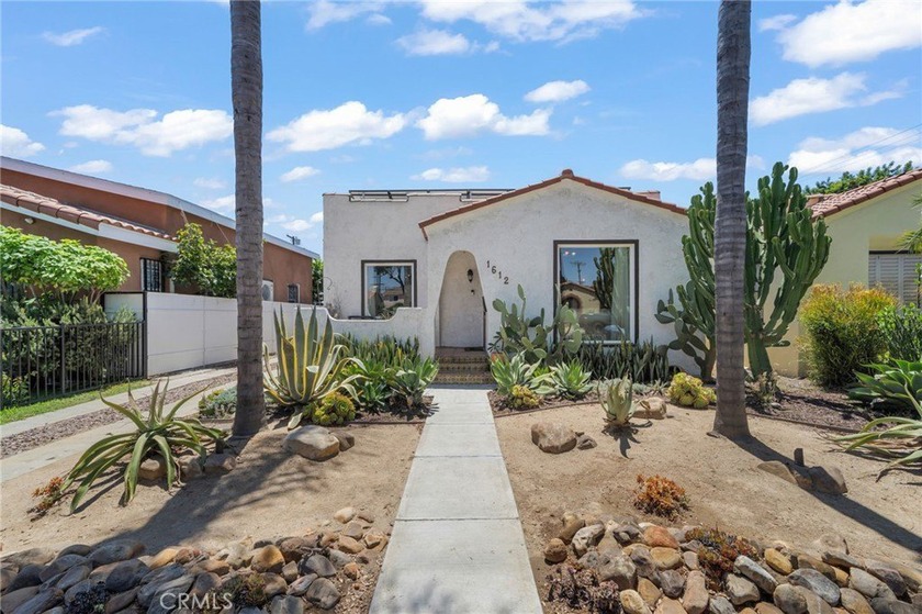 Timeless Spanish-style architecture meets modern comfort in this - Beach Home for sale in Long Beach, California on Beachhouse.com