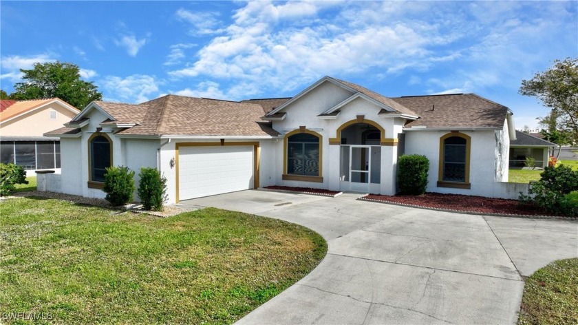 This beautiful home offers 3 bedrooms, 2 baths, and an attached - Beach Home for sale in Lehigh Acres, Florida on Beachhouse.com