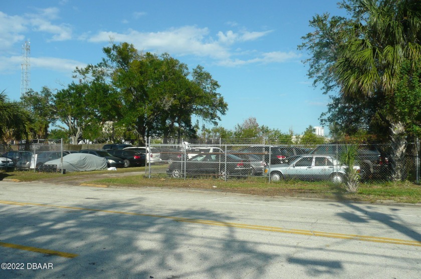 Chain-link fenced lot with canal on rear of property that leads - Beach Lot for sale in Daytona Beach, Florida on Beachhouse.com