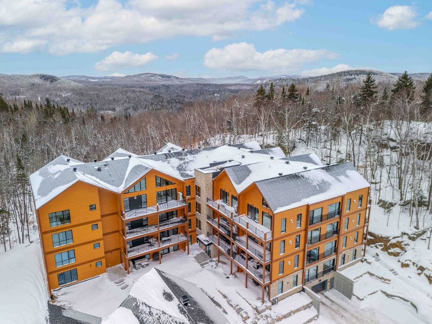 DELIVERY IN APRIL 2026! Located in the heart of the prestigious - Beach Condo for sale in Mont-Tremblant,  on Beachhouse.com