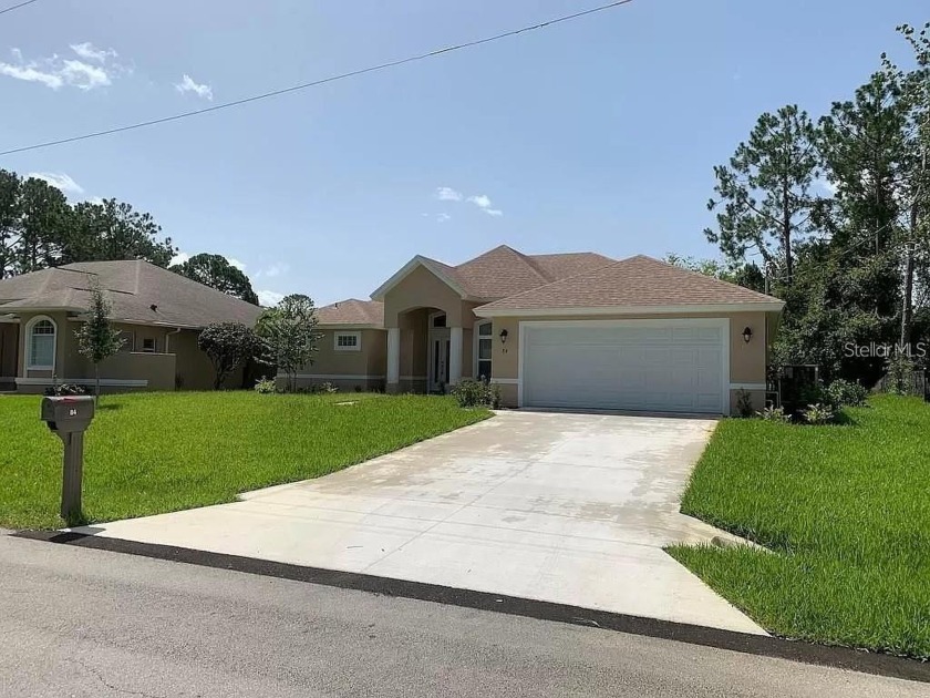 Charming 3-Bedroom, 2-Bathroom Pool Home on Freshwater Canal in - Beach Home for sale in Palm Coast, Florida on Beachhouse.com