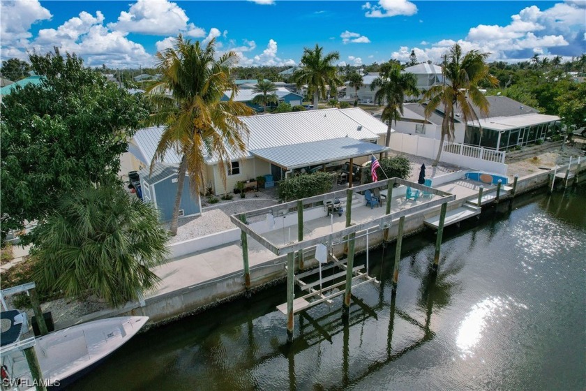This waterfront island home is move in ready!  With over 90 feet - Beach Home for sale in Bokeelia, Florida on Beachhouse.com