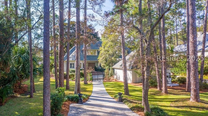 This inviting home welcomes you with an expansive front yard and - Beach Home for sale in Hilton Head Island, South Carolina on Beachhouse.com