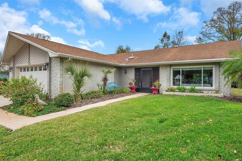 Welcome to your dream home in the highly coveted Highland Lakes - Beach Home for sale in Palm Harbor, Florida on Beachhouse.com