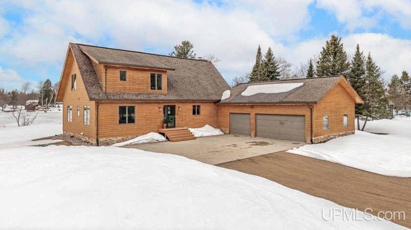 Gorgeous riverfront home with 17 acres and almost 300' of - Beach Home for sale in Rapid River, Michigan on Beachhouse.com