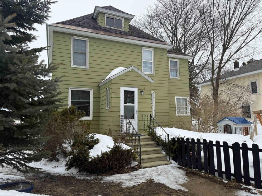 Embrace the character of this historic four-bedroom home with - Beach Home for sale in Munising, Michigan on Beachhouse.com