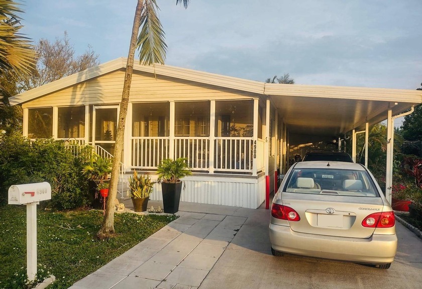 This beautifully maintained double-wide mobile home offers - Beach Home for sale in Deerfield Beach, Florida on Beachhouse.com