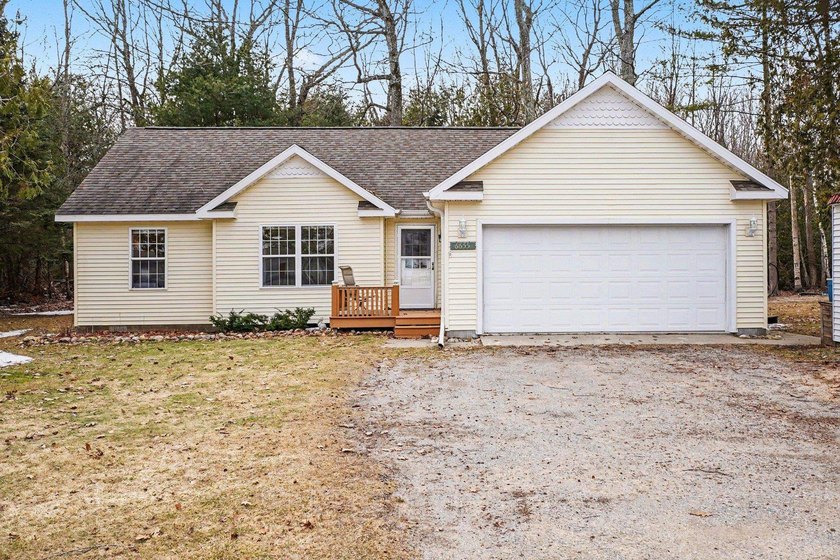 Wonderful on Woodlea!  Discover the charm of this serene retreat - Beach Home for sale in Oscoda, Michigan on Beachhouse.com