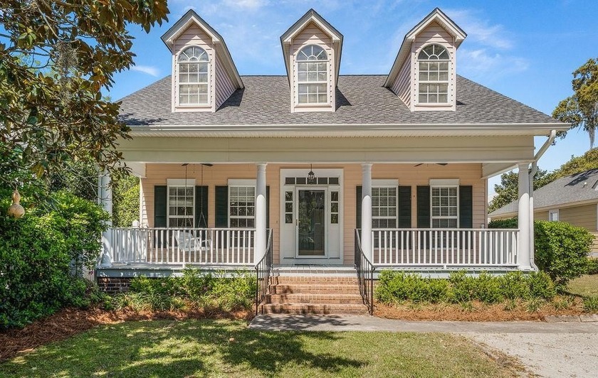 Tucked beneath a canopy of majestic oaks and nestled behind the - Beach Home for sale in Pawleys Island, South Carolina on Beachhouse.com