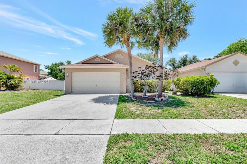 This charming 3-bedroom, 2-bath home offers abundant privacy and - Beach Home for sale in West Palm Beach, Florida on Beachhouse.com