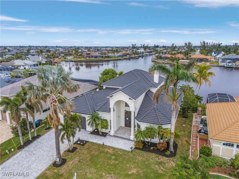 ELEVATION, LOCATION, BEAUTY! This GULF ACCESS 4 bed/5 bath 3,208 - Beach Home for sale in Cape Coral, Florida on Beachhouse.com