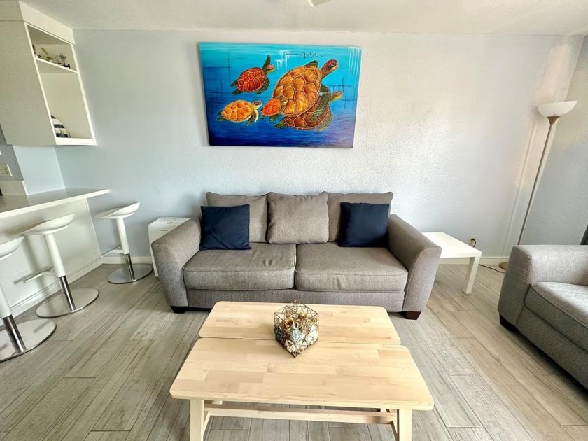 This inviting space boasts an open-concept layout with modern - Beach Condo for sale in South Padre Island, Texas on Beachhouse.com