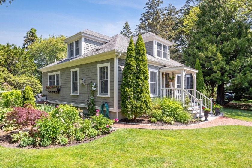 Nestled gracefully on a sun-dappled corner lot in the heart of - Beach Home for sale in Sandwich, Massachusetts on Beachhouse.com