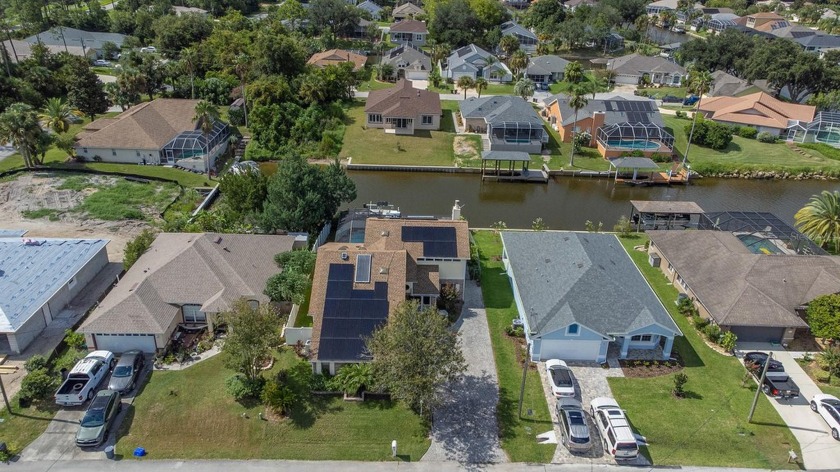 This solar powered 3 bedroom, 3 bath, salt water canal pool home - Beach Home for sale in Palm Coast, Florida on Beachhouse.com