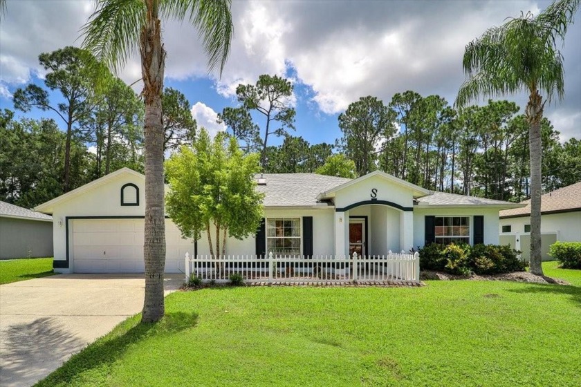 Step into this beautifully maintained 4-bedroom, 2-bathroom - Beach Home for sale in Palm Coast, Florida on Beachhouse.com