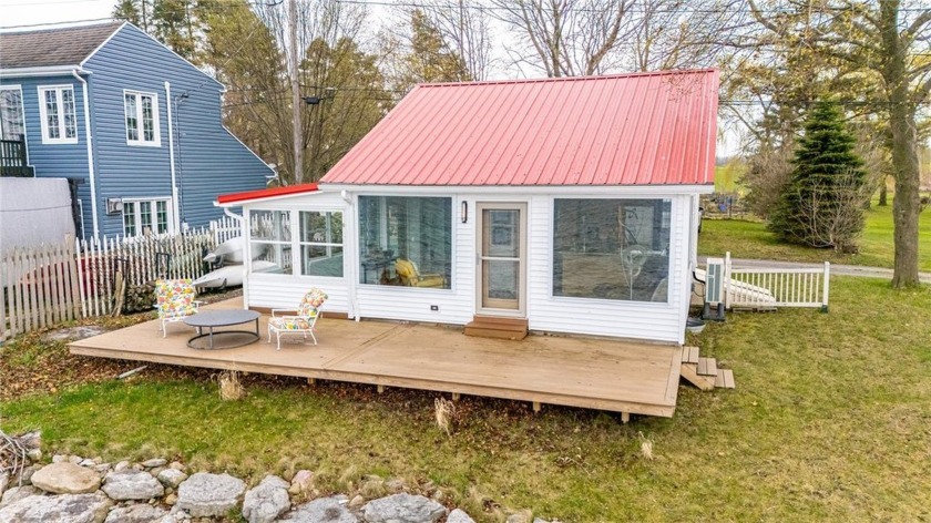 Welcome to your perfect lakeside escape.This charming waterfront - Beach Home for sale in Yates, New York on Beachhouse.com