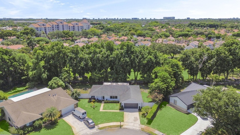 Tucked away on a quiet cul-de-sac and backing onto the lush - Beach Home for sale in Boca Raton, Florida on Beachhouse.com