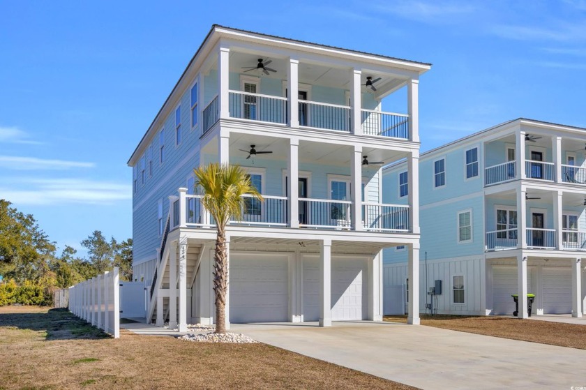 This stunning 4-bedroom, 5.5-bath raised beach home in the heart - Beach Home for sale in Murrells Inlet, South Carolina on Beachhouse.com
