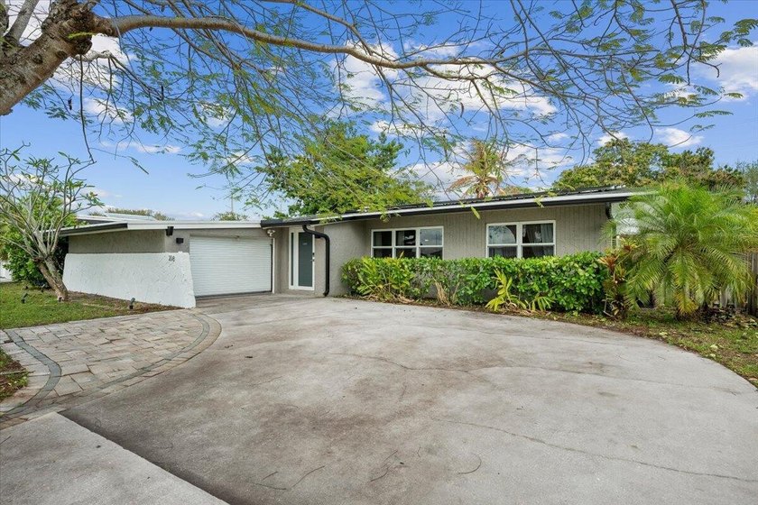 Welcome to this charming updated home located in the heart of - Beach Home for sale in Royal Palm Beach, Florida on Beachhouse.com